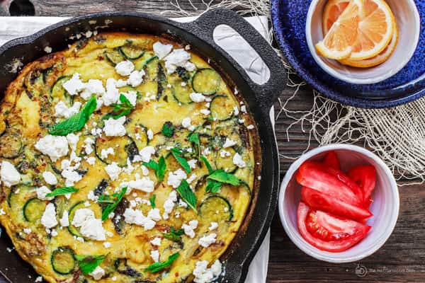 Baked omelet garnished with feta cheese, ready to be served