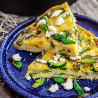 Middle Eastern Zuchini Baked Omelet Recipe | The Mediterranean Dish. A dense, flavor packed version of fritatta recipe. With zucchini, onions, fresh mint and olive oil. The perfect breakfast or brunch. See the step-by-step at The Mediterranean Dish!