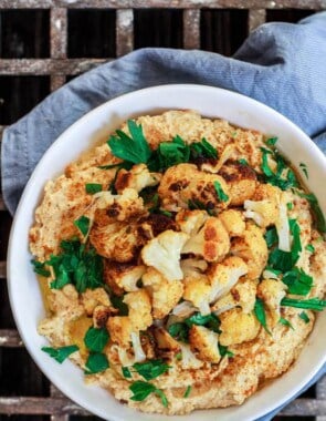 Roasted Cauliflower Tahini Dip | The Mediterranean Dish. A spicy Middle Eastern style dip with roasted cauliflowers, tahini paste, garlic and warm spices like turmeric and smoked paprika. A must try appetizer! See the step-by-step tutorial on The Mediterranean Dish.