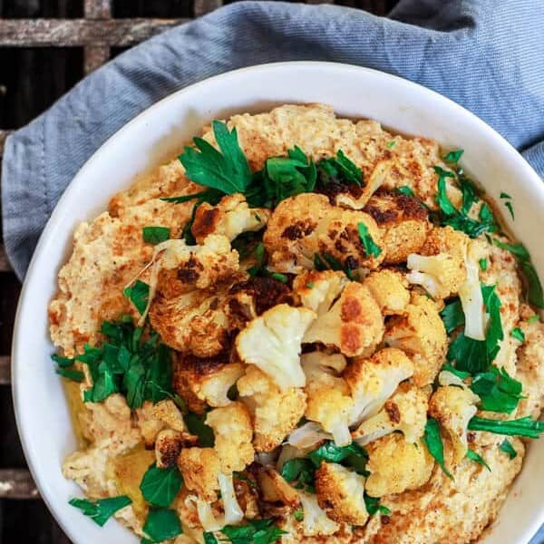 Roasted Cauliflower Tahini Dip | The Mediterranean Dish. A spicy Middle Eastern style dip with roasted cauliflowers, tahini paste, garlic and warm spices like turmeric and smoked paprika. A must try appetizer! See the step-by-step tutorial on The Mediterranean Dish.