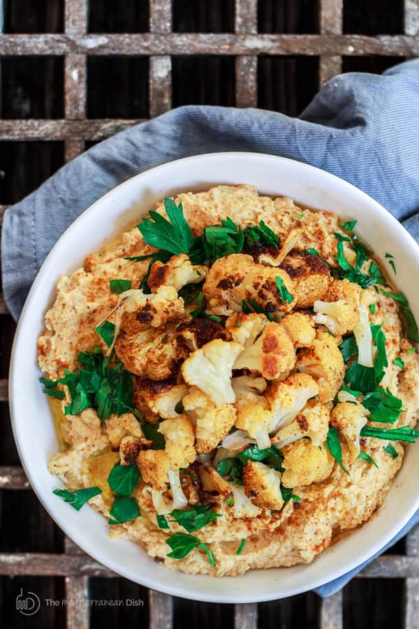 Roasted Cauliflower Tahini Dip garnished with chunks of roasted cauliflower and olive oil drizzle. Ready to be served.