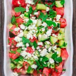 Mediterranean Watermelon Salad Recipe | The Mediterranean Dish. A light and fresh watermelon salad with cucumbers, feta cheese and fresh herbs. All dressed in a honey vinaigrette.