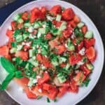 Mediterranean Watermelon Salad Recipe | The Mediterranean Dish. A light and fresh watermelon salad with cucumbers, feta cheese and fresh herbs. All dressed in a honey vinaigrette.