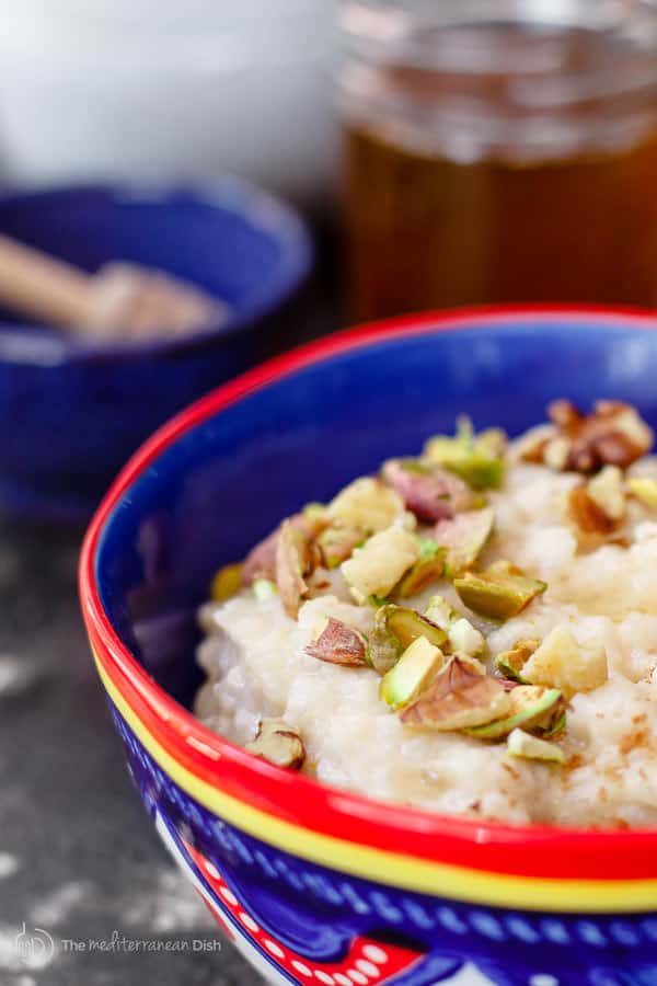 Close-up of Rice Pudding garnished with nuts and honey