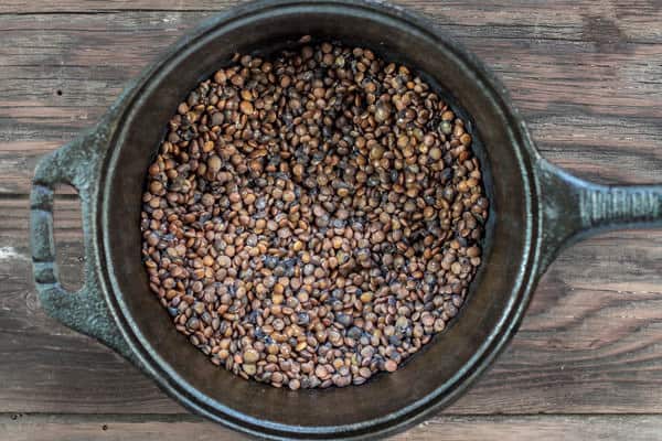 Lentils added to a pot of water