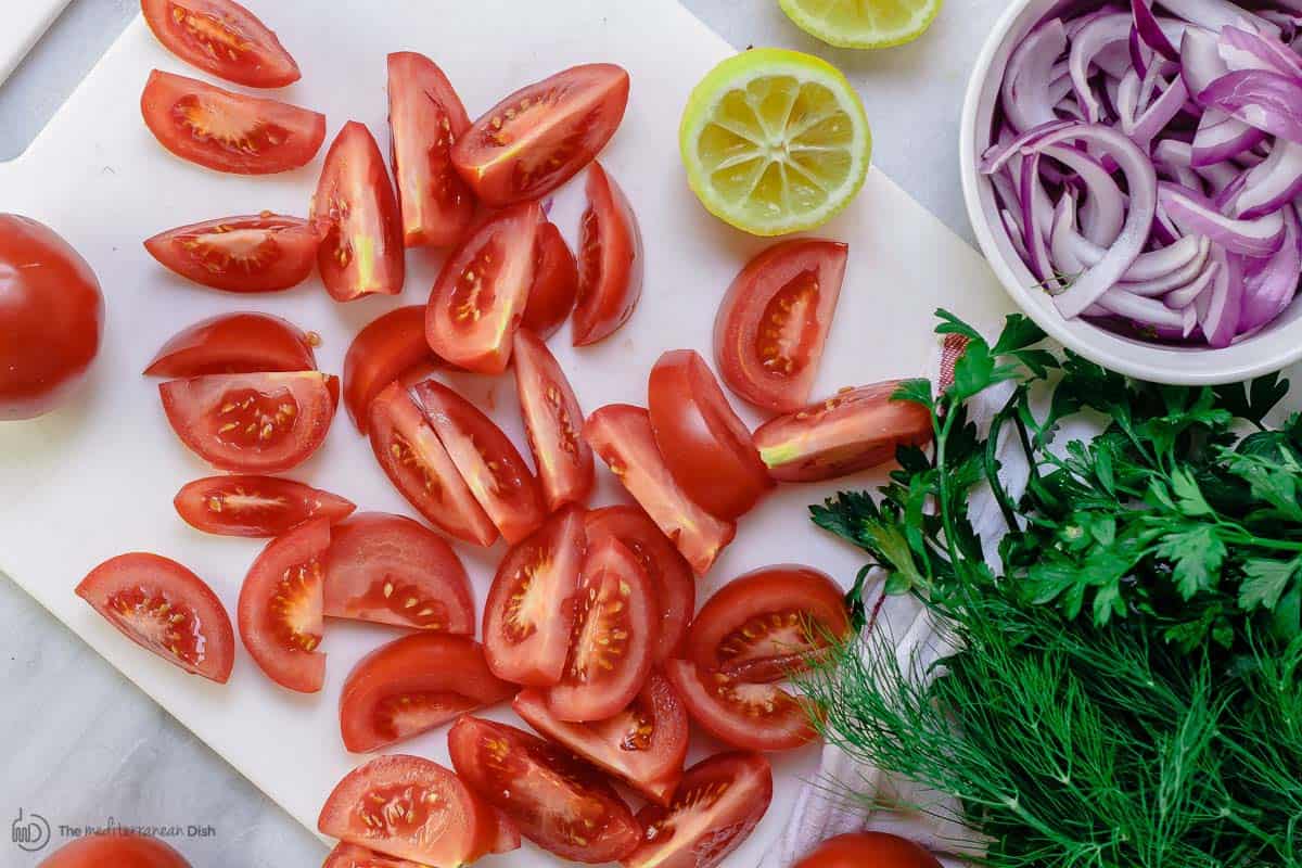 Sliced tomatoes, onions and fresh herbs