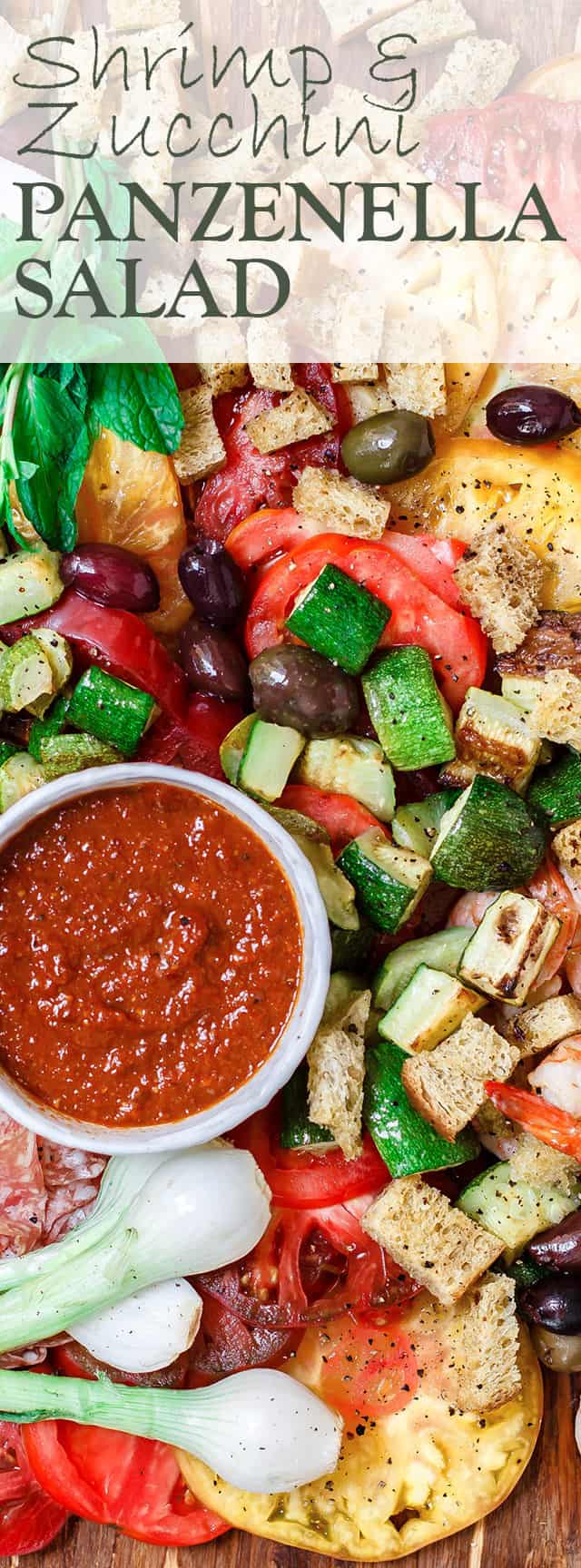Shrimp and Zucchini Panzanella Salad Recipe | The Mediterranean Dish. An all-star Italian Panzenalla Salad with heirloom tomatoes, shrimp, roasted zucchini and more! A thick garlicy sun-dried tomato dressing served on the side! The perfect appetizer for a crowd! See more at TheMediterraneanDish.com