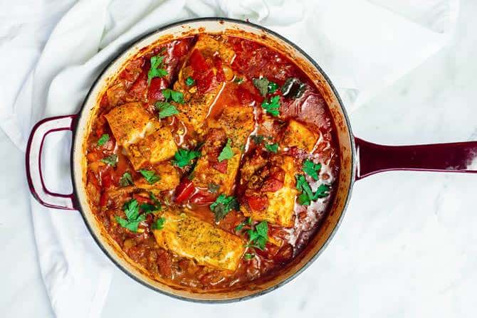 Fish fillet once cooked with the tomato sauce in the braiser