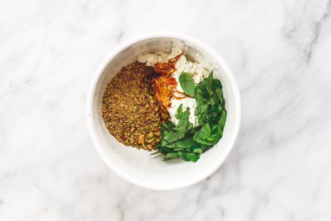 Ingredients for Crostini added to a bowl to be mixed together