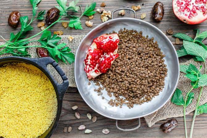 Detailed view of jeweled couscous and brown lentils.