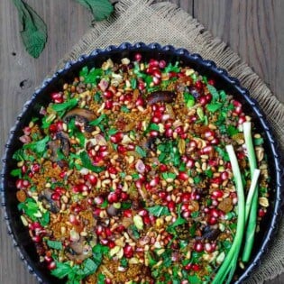 Jeweled Couscous Recipe with Pomegranate and Lentils | The Mediterranean Dish. An easy couscous recipe that makes the perfect side dish or salad! With lentils, nuts, pomegranate seeds, and flavor-packed with Mediterranean spices. Makes any dinner special! And perfect for Thanksgiving and Christmas too! See the tutorial on TheMediterraneanDish.com