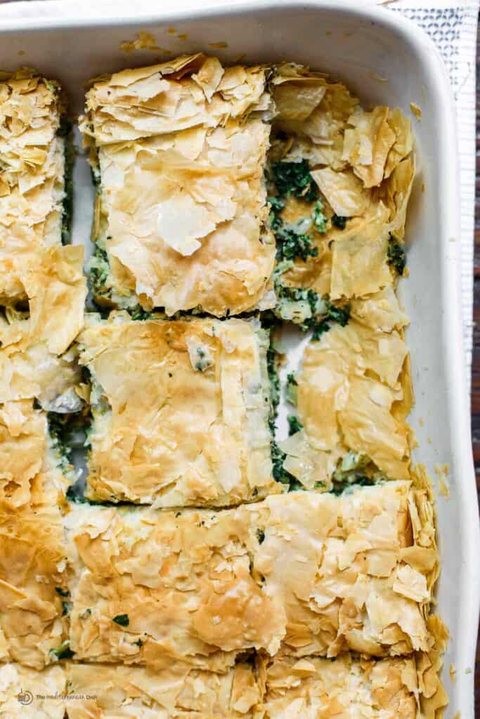 Spanakopita served in a baking dish