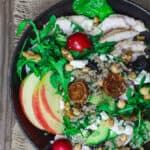 Chicken Arugula Quinoa Bowls | The Mediterranean Dish. These loaded quinoa bowls are chock-full of nutrition and delicious Mediterranean flavors. Quinoa with chopped vegetables, leafy greens, chickpeas, chicken, and a good does of walnuts and figs. All of it dressed in a delicious honey vinaigrette. A perfectly delicious way to detox. Get the recipe on TheMediterraneanDish.com