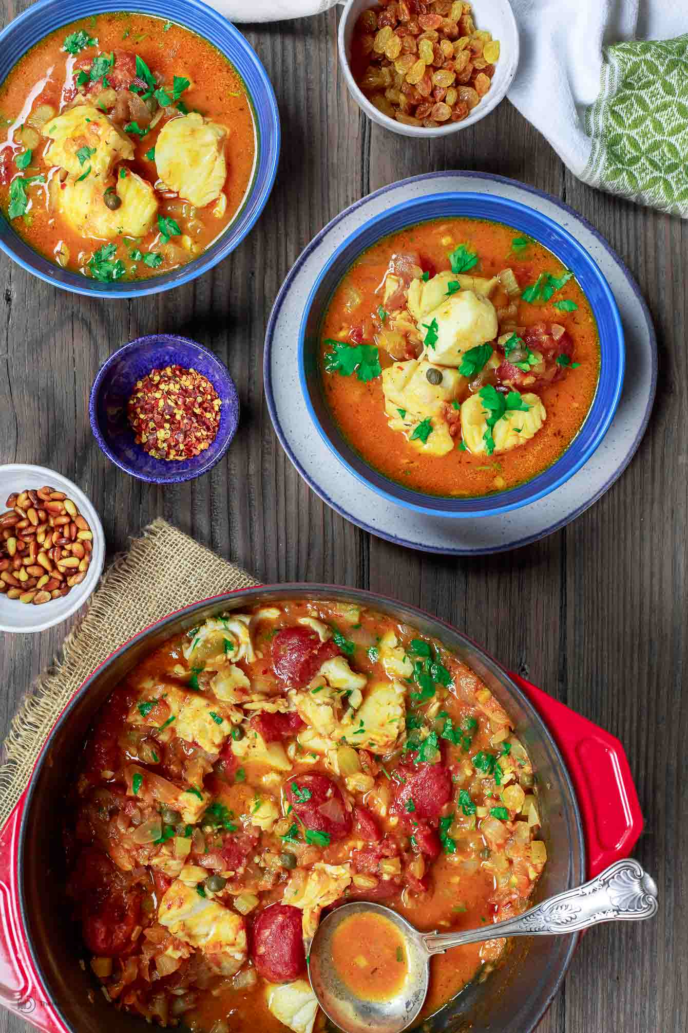 Sicilian Fish Stew Recipe | The Mediterranean Dish. Italian comfort in a bowl! My favorite! Fish fillet pieces cooked in a white wine and tomato broth with garlic, capers and more! Super easy and quick recipe. See it on TheMediterraneanDish.com