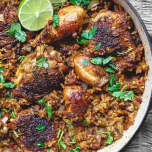 Spanish Chicken and Rice Recipe with Chorizo | The Mediterranean Dish. A simpler version of Arroz con Pollo, this Spanish chicken and rice recipe with chorizo is every bit a satisfying and flavorful, one-pan-wonder! See the recipe on TheMediterraneanDish.com