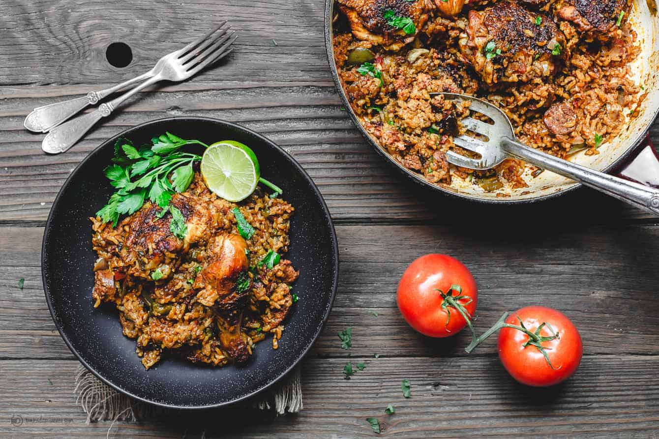 Spanish Chicken and Rice served with tomatoes and fresh parsley