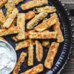 Baked Eggplant Fries with Greek Tzatziki Sauce | The Mediterranean Dish. Quick, simple and addictive! These eggplant fries are crispy on the outside, super tender and velvety on the inside. Served with Greek tzatziki sauce. See the easy recipe on TheMediterraneanDish.com