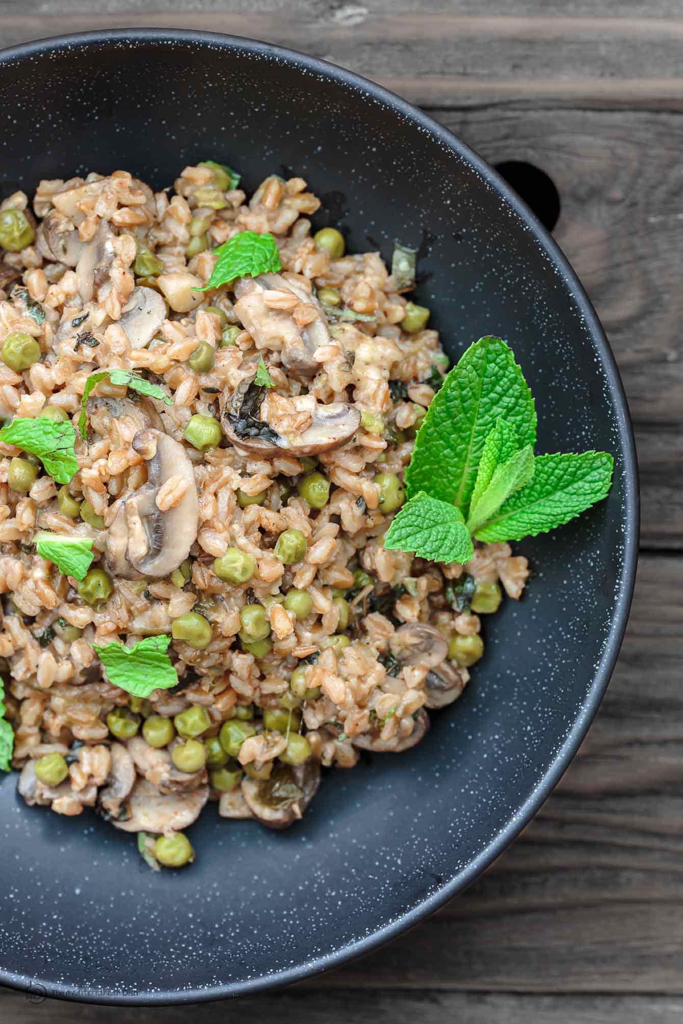 Farro with Mushrooms and Peas served in a bowl