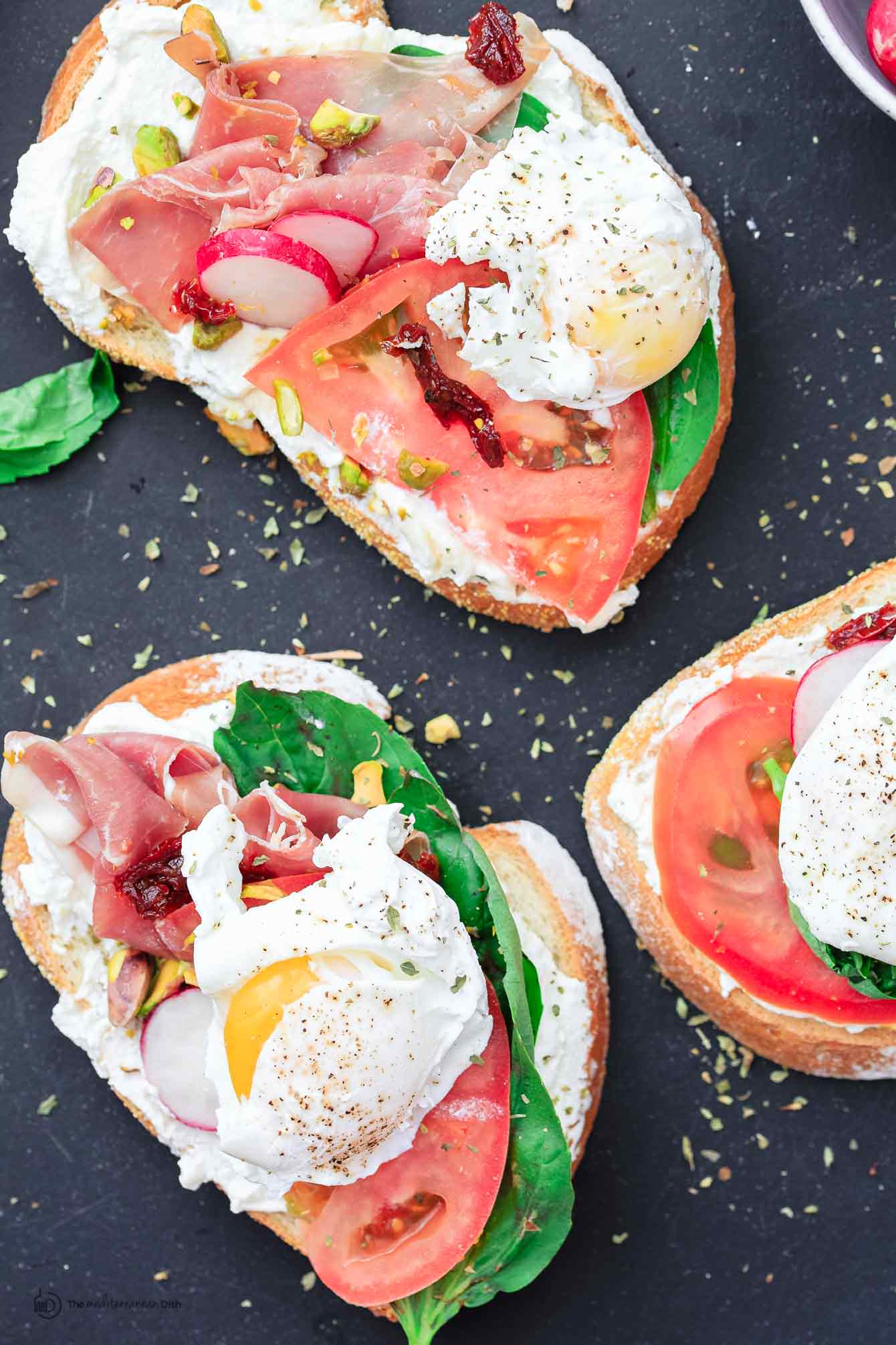 Breakfast Open Faced Sandwich garnished with salt, pepper, and radish slices