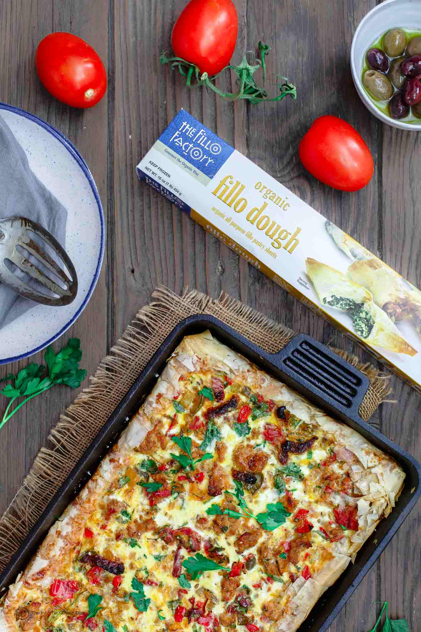 Box of fillo dough, tomatoes, olives and baked strata