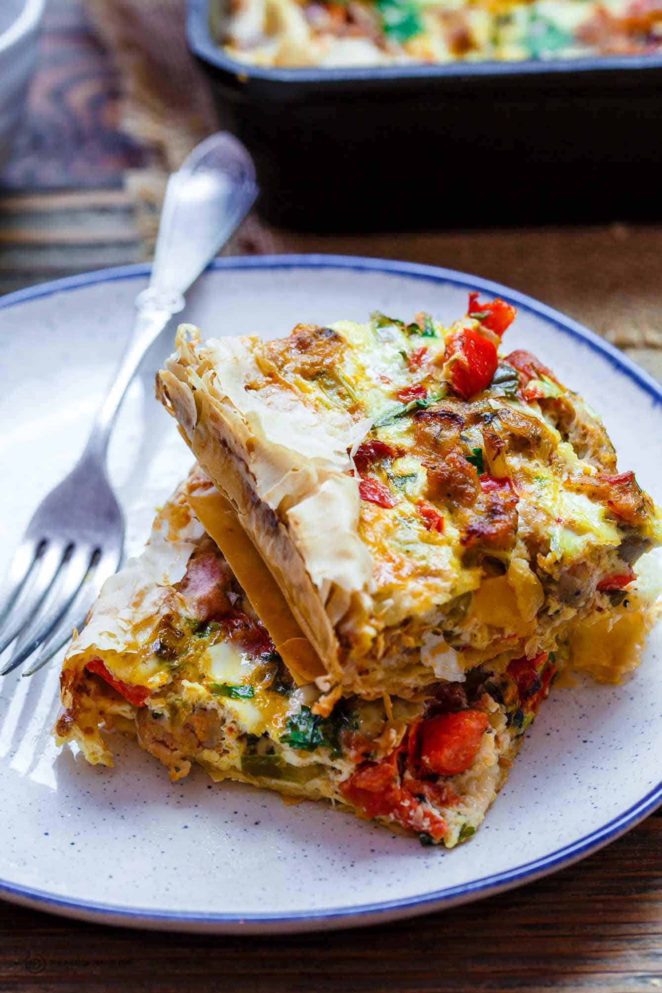 Two slices of strata served on a plate