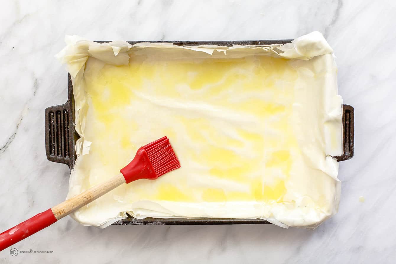Brushing dough with oil/butter mix