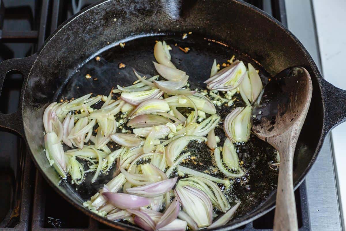 Shallots and garlic cooking in skillet
