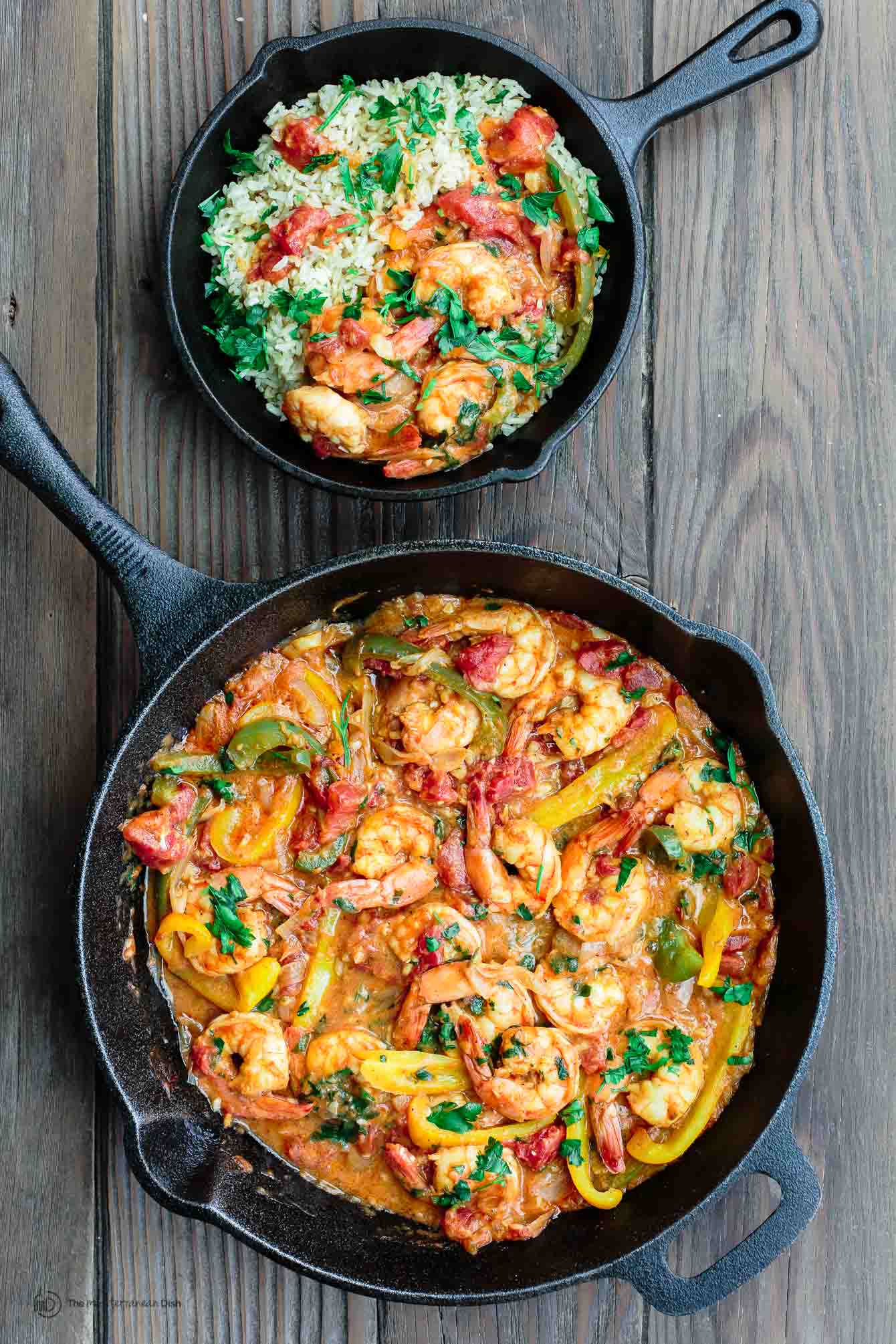 Shrimp in skillet with shallots, bell peppers and a white wine-olive oil sauce