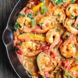 Mediterranean easy shrimp with bell peppers and shallots in skillet