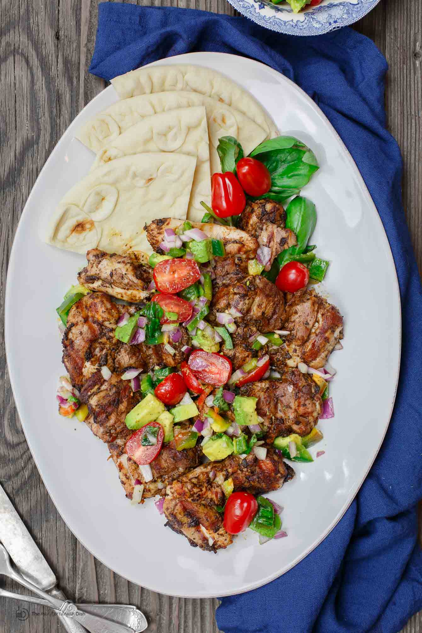 Chicken Thighs with a Persian BBQ marinade served with pita bread