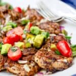 Persian-Style Barbecue Chicken Thighs Recipe | The Mediterranean Dish. Quick recipe for flavor-packed, tender chicken with Persian flavors. No waiting with this marinade! Top the chicken with our easy tomato avocado salad! See the full recipe on TheMediterraneanDish.com