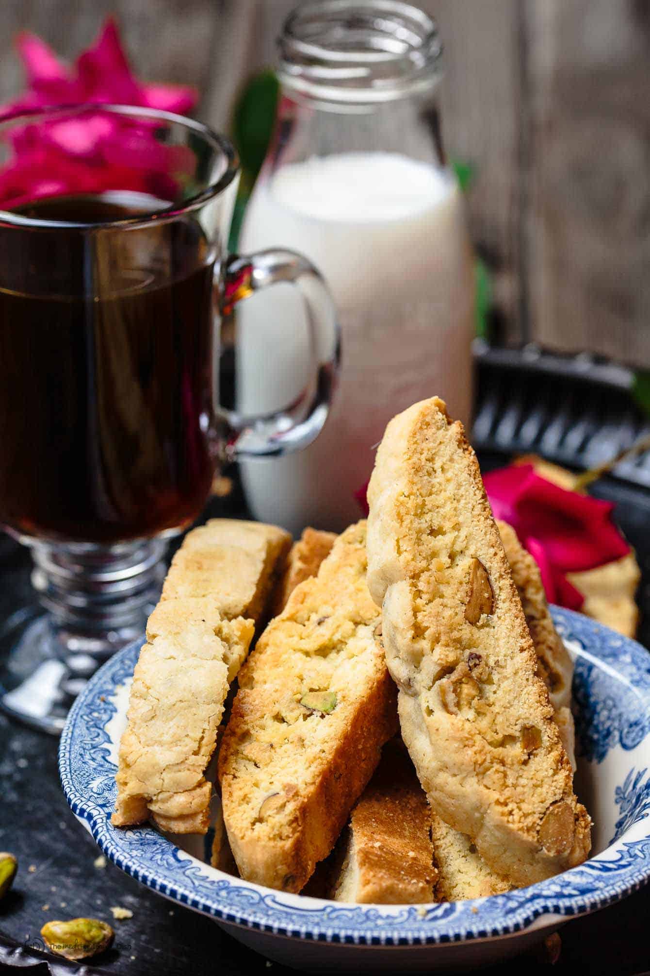 Italian biscotti served with a side of coffee and milk