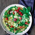 Mediterranean Farmer's Market Hummus Dip | The Mediterranean Dish. Easy, BIG hummus dip! Ready in like 10 minutes! Show-stopping hummus loaded with Mediterranean favorites: Fresh herbs and greens, veggies, feta, olives, sun-dried tomatoes…Get the recipe on TheMediterraneanDish.com