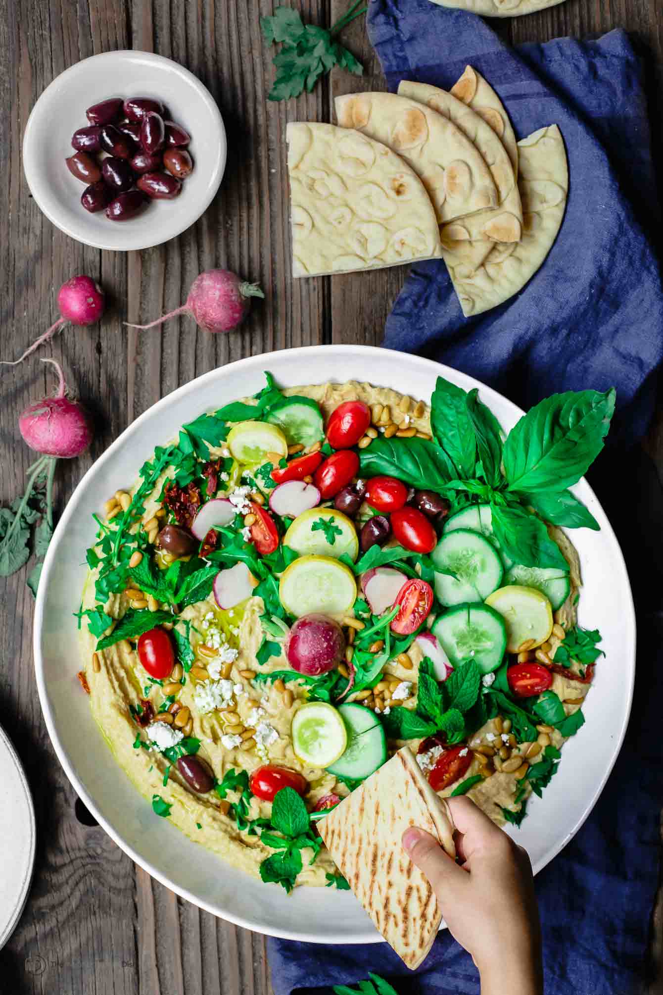 Hummus Dip served with olives and pita bread