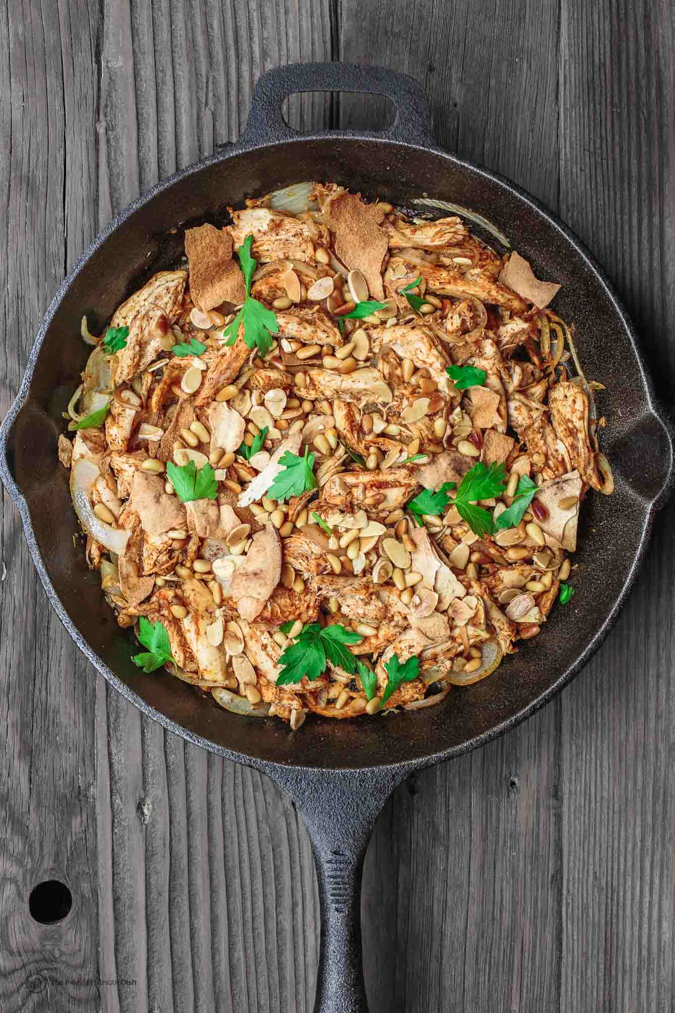 Skillet containing Lebanese Chicken Fatteh 