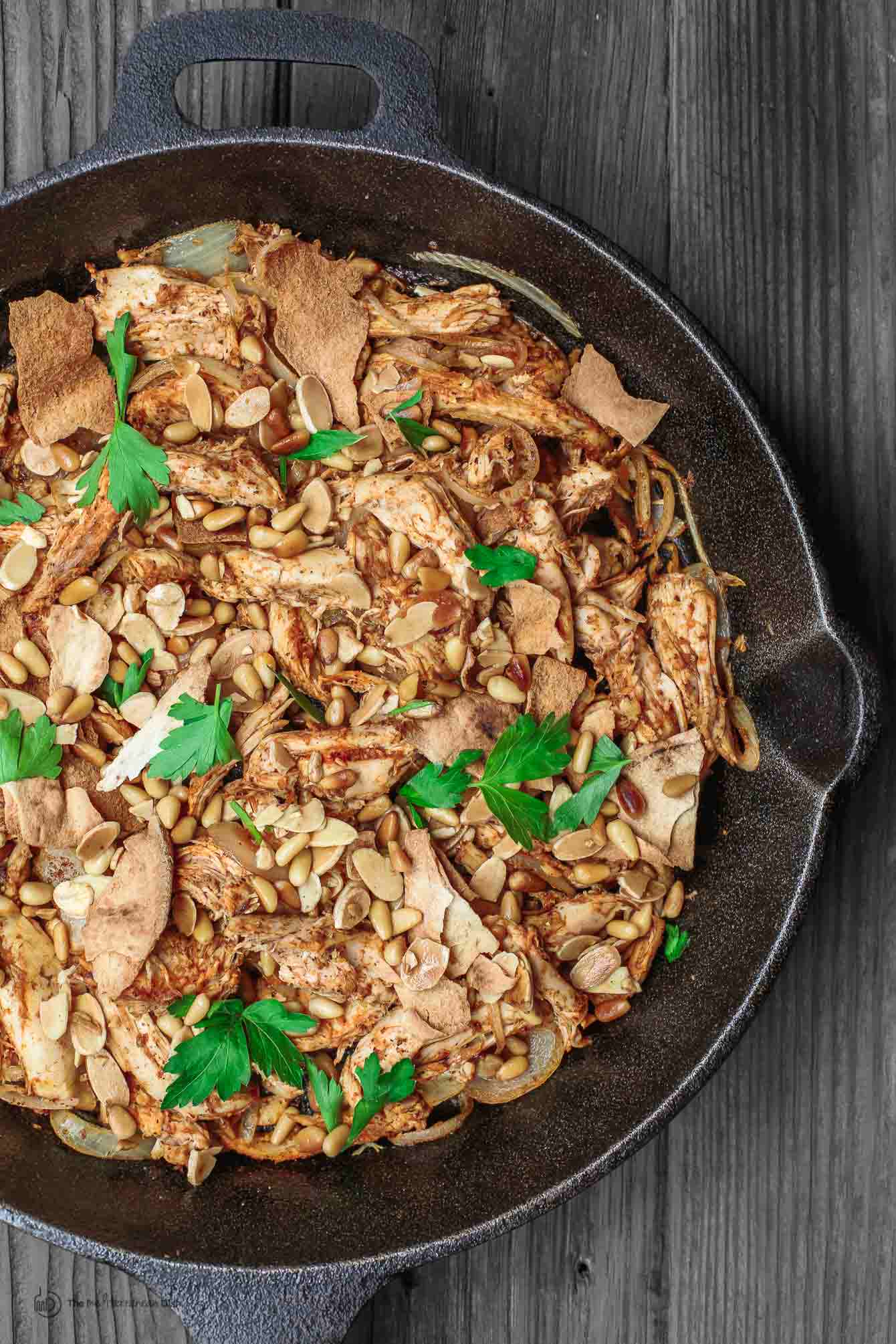 Fatteh Chicken Dinner Bowls garnished with pine nuts and almonds