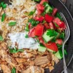 Lebanese Chicken Fatteh Dinner Bowls | The Mediterranean Dish. Flavor-packed Lebanese chicken recipe with toasted pita, rice and a simple Mediterranean salad all in one bowl. Check out the full recipe on TheMediterraneanDish.com