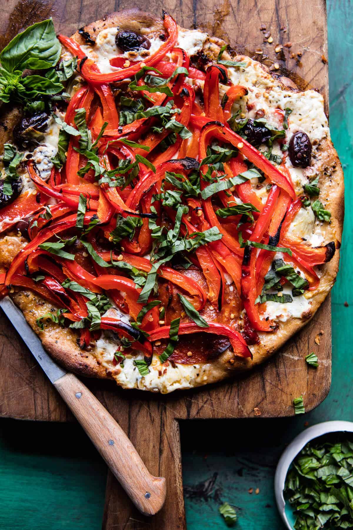 25 Mediterranean Picnic Recipes | The Mediterranean Dish. This Mediterranean Roasted Red Pepper Pizza from Half Baked Harves plus a list of amazing picnic recipes with a Mediterranean twist. Easy, bright, Mediterranean salads; Chickpea salads; Pasta salads; Greek macaroni and cheese; grilled chicken and kofta kabobs; no-mayo zesty tuna; brownies and lemon cakes! See the recipes on TheMediterraneanDish.com