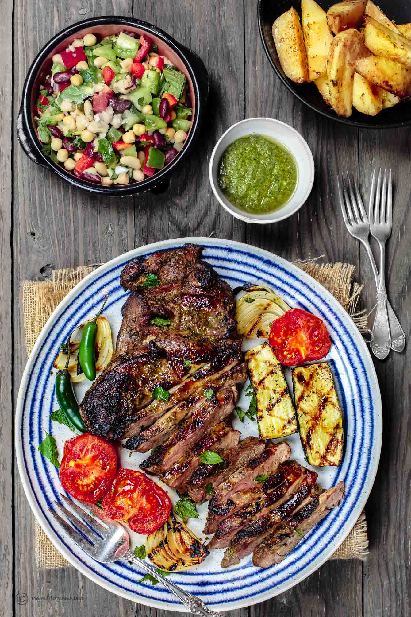 Grilled Lamb served with a vegetable salad and roasted potatoes