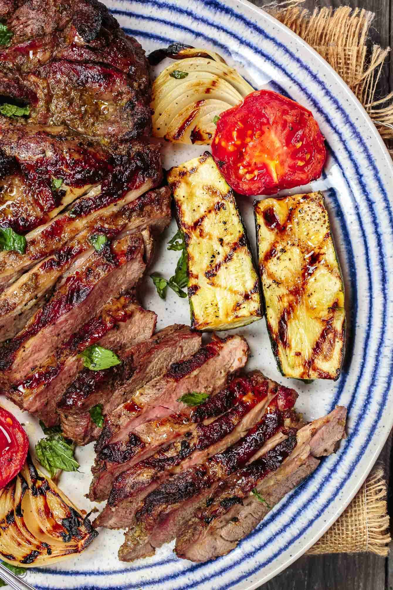 Grilled Lamb served with grilled zucchini and tomatoes