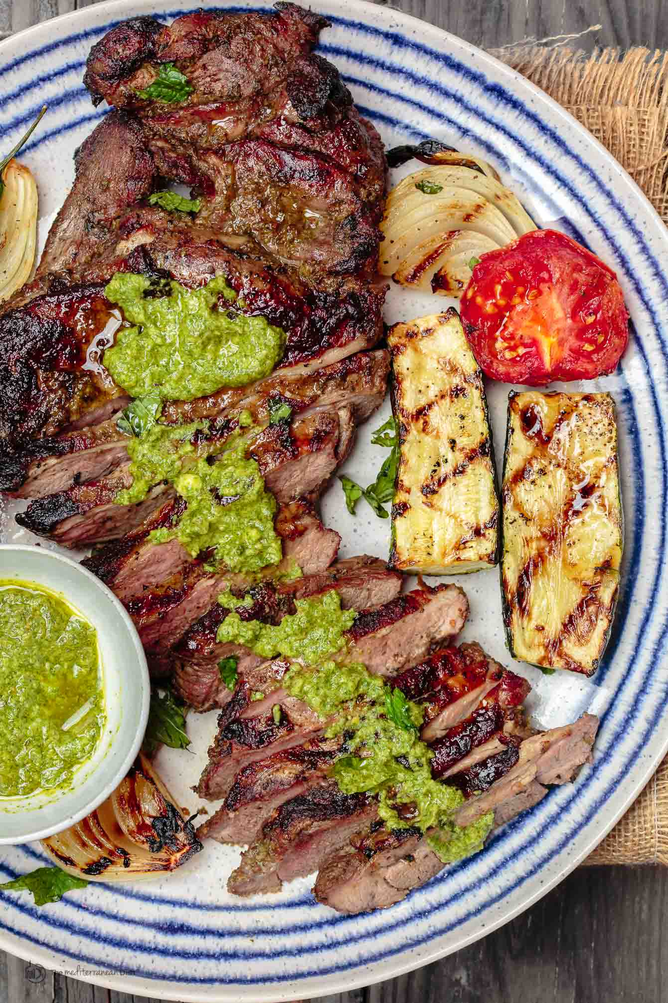 Mediterranean Grilled Lamb topped with Mint Pesto and served with grilled vegetables