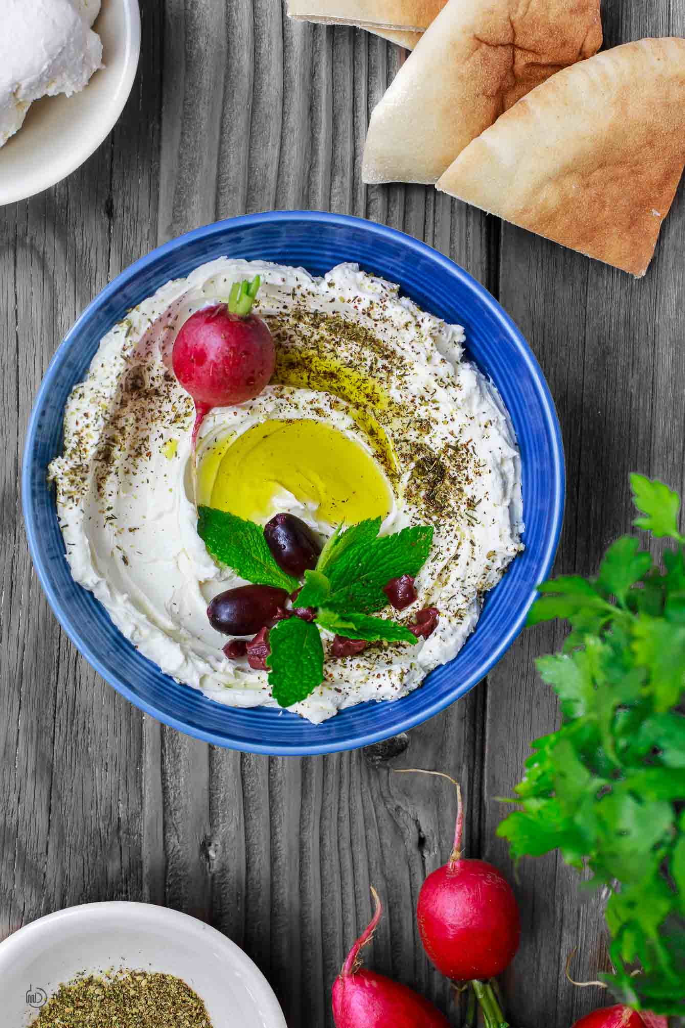 Homemade Labneh Recipe | The Mediterranean Dish. Homemade labneh, Middle Eastern yogurt cheese that is tangy, creamy and lighter than your average cream cheese. Use it as mezze or to spread on your favorite bread. Versatile and super easy to make! A two-step recipe from TheMediterraneanDish.com