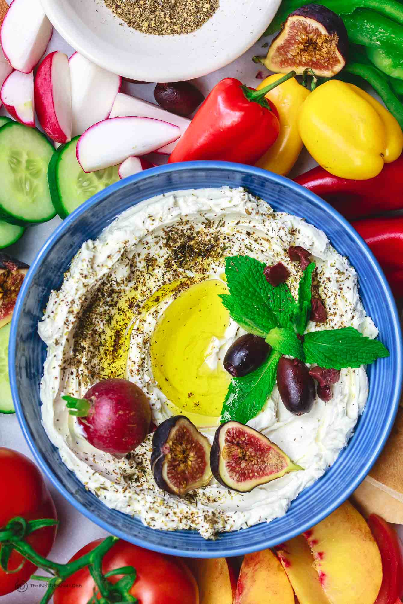 Homemade Labneh Recipe | The Mediterranean Dish. Homemade labneh, Middle Eastern yogurt cheese that is tangy, creamy and lighter than your average cream cheese. Use it as mezze or to spread on your favorite bread. Versatile and super easy to make! A two-step recipe from TheMediterraneanDish.com