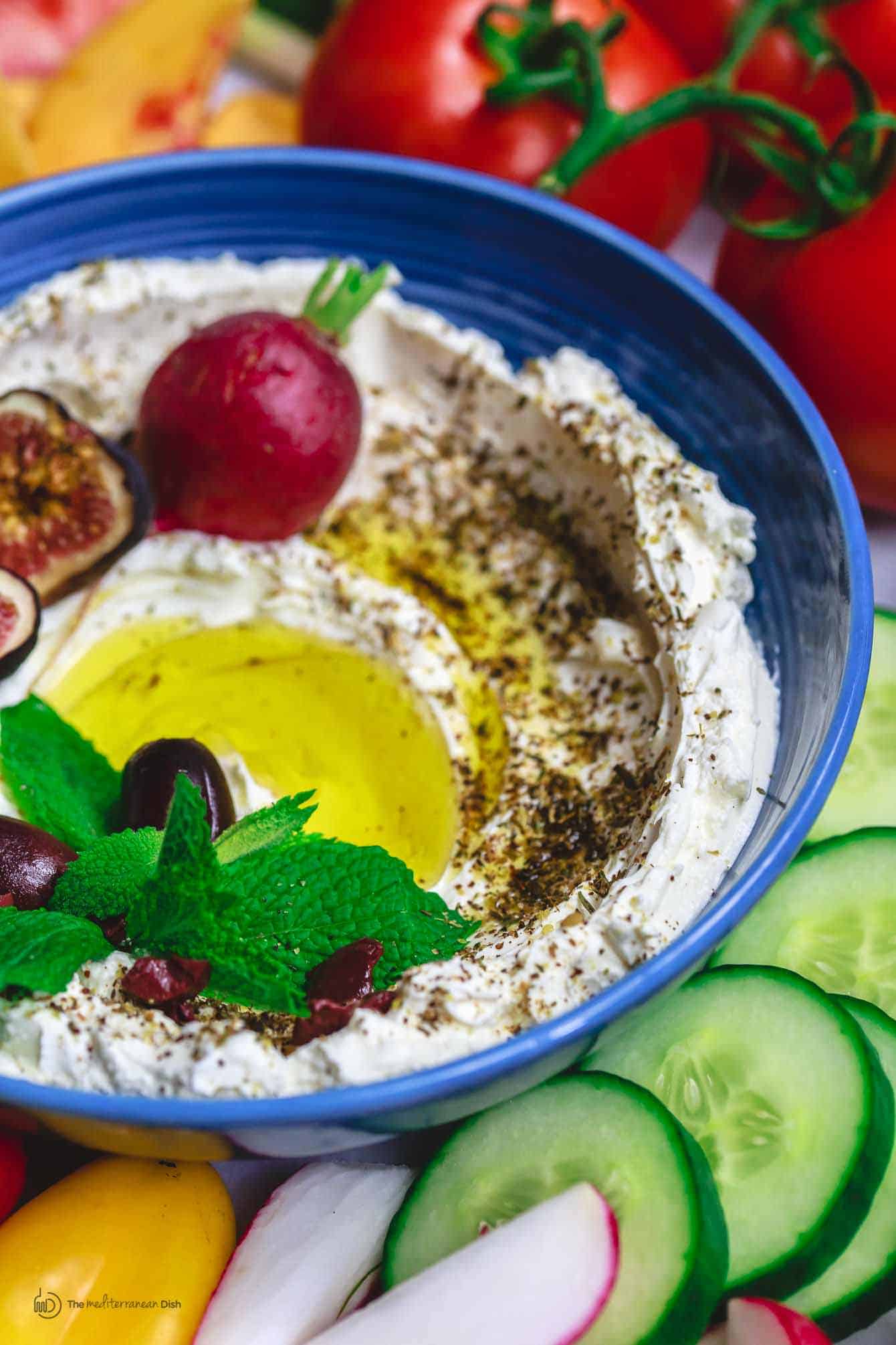 Homemade Labneh Recipe | The Mediterranean Dish. Homemade labneh, Middle Eastern yogurt cheese that is tangy, creamy and lighter than your average cream cheese. Use it as mezze or to spread on your favorite bread. Versatile and super easy to make! A two-step recipe from TheMediterraneanDish.com