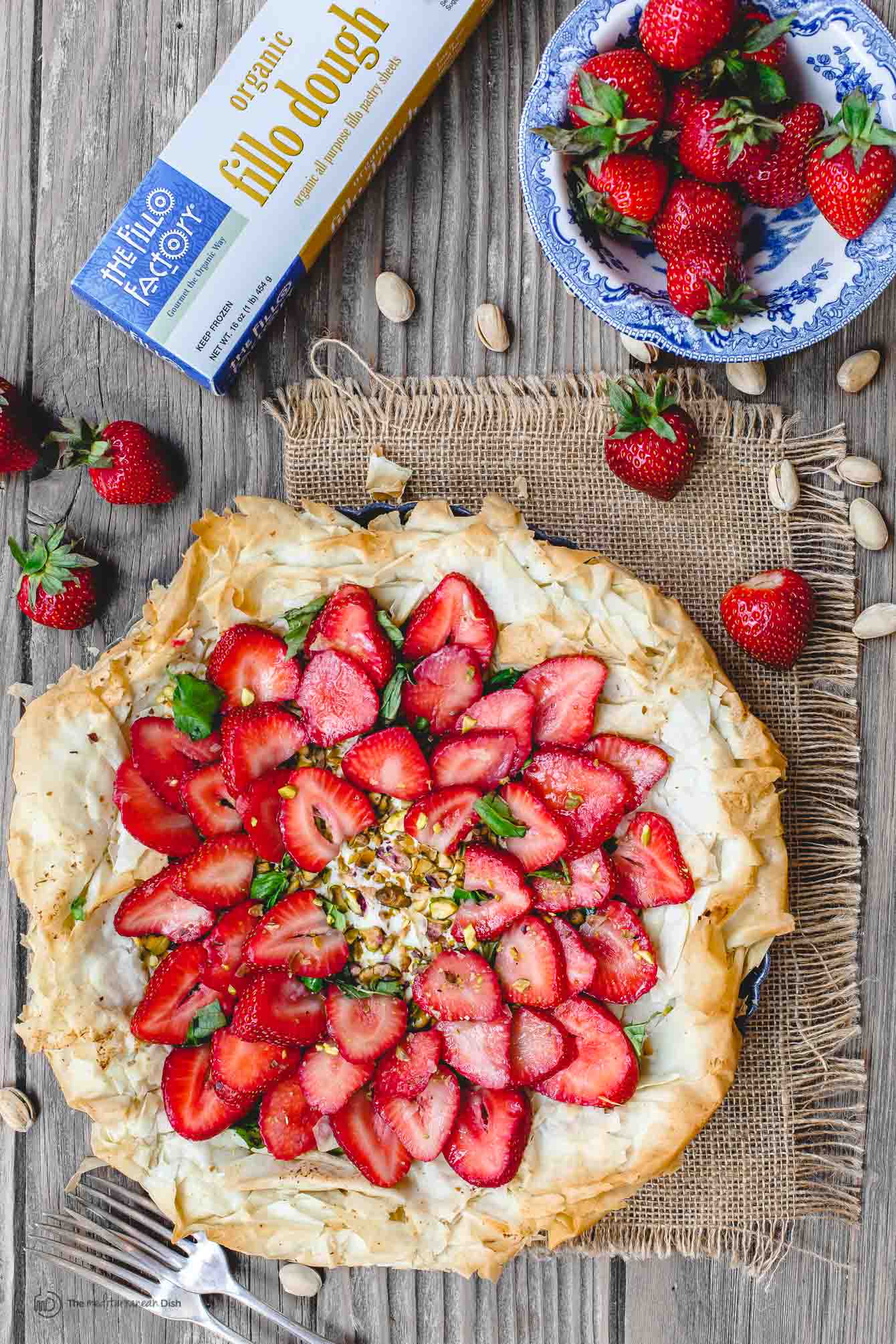 Feta Strawberry Tart with bowl of fresh strawberries on the side