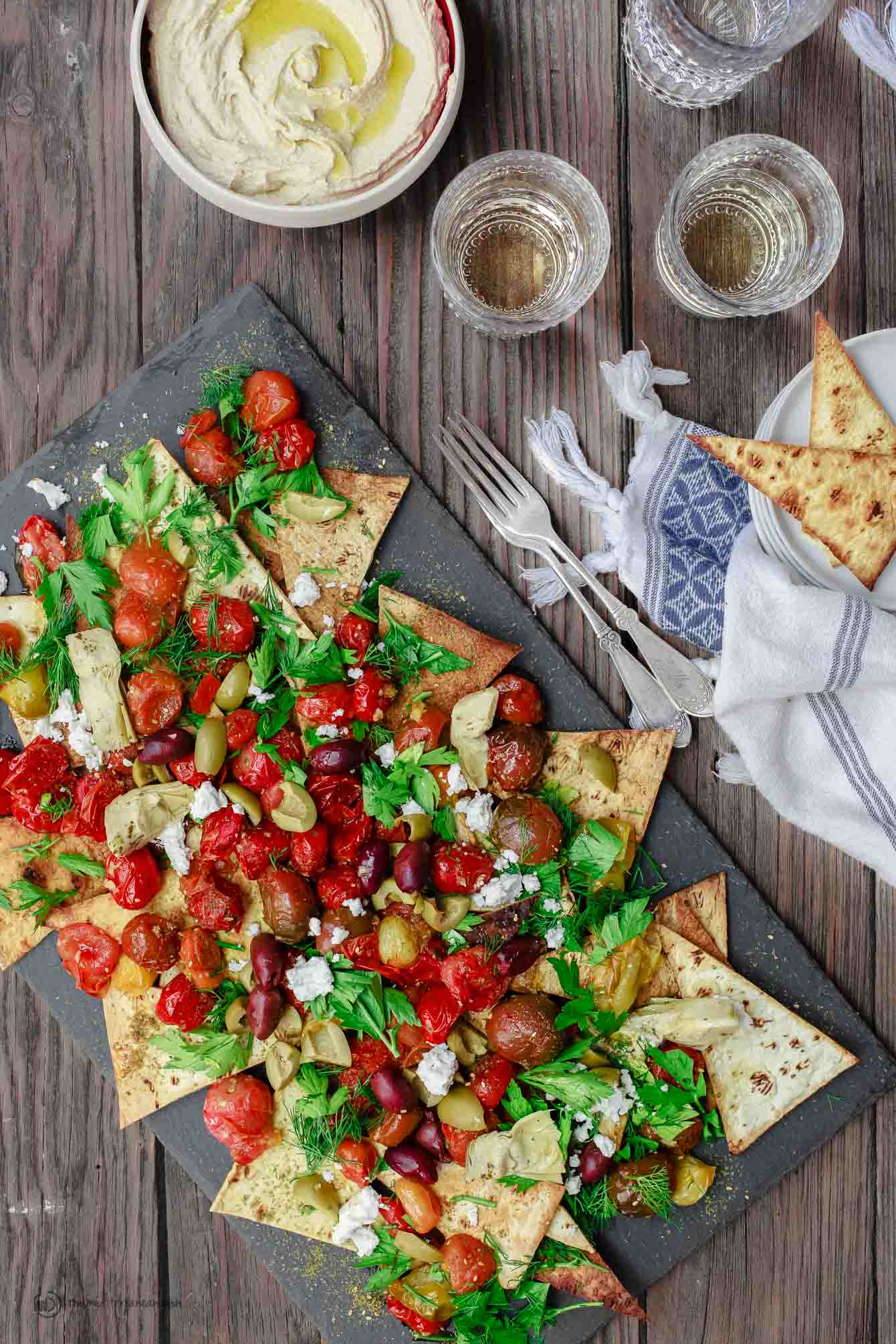 Flatbread nachos served with hummus on the side