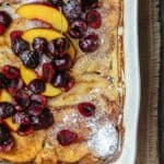 Overnight Baked French Toast Recipe with Challah | The Mediterranean Dish. Stupid easy and healtiher overnight french toast! Challah french toast with a reduced-fat yogurt custard, topped with fresh fruit and honey simple syrup. Prep it overnight and come morning, simply slip into the oven and enjoy your coffee!