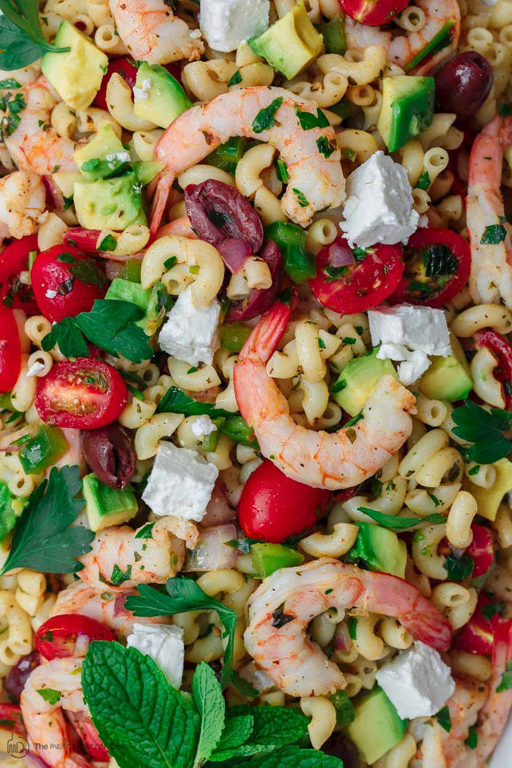 Close-up of shrimp and feta cheese in Mediterranean pasta salad