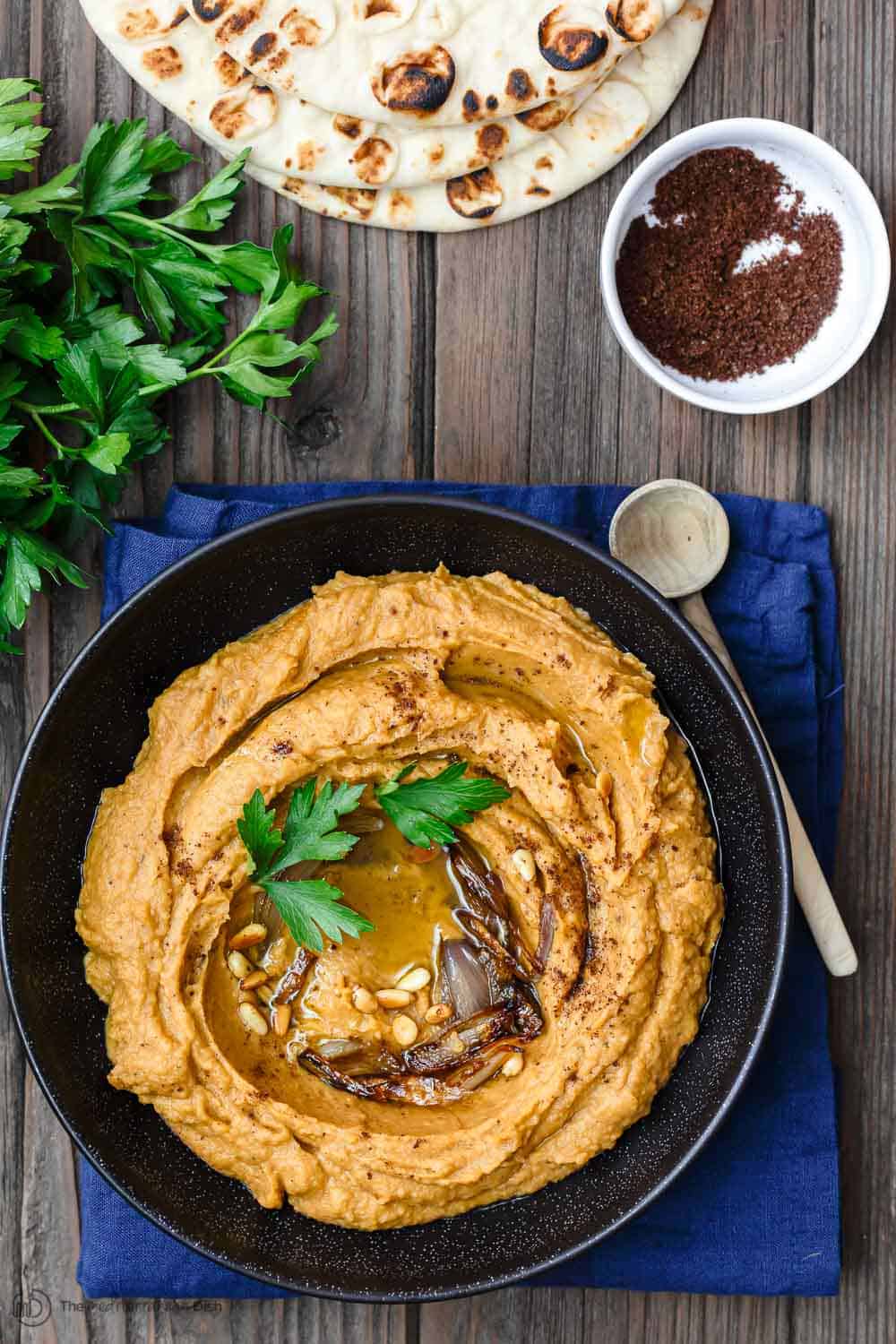 Bean Dip served with pita bread and garnished with extra olive oil