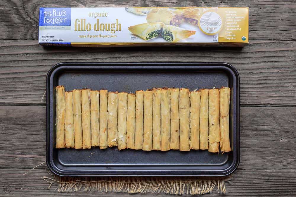 Pan of baked rolls containing cashew filling